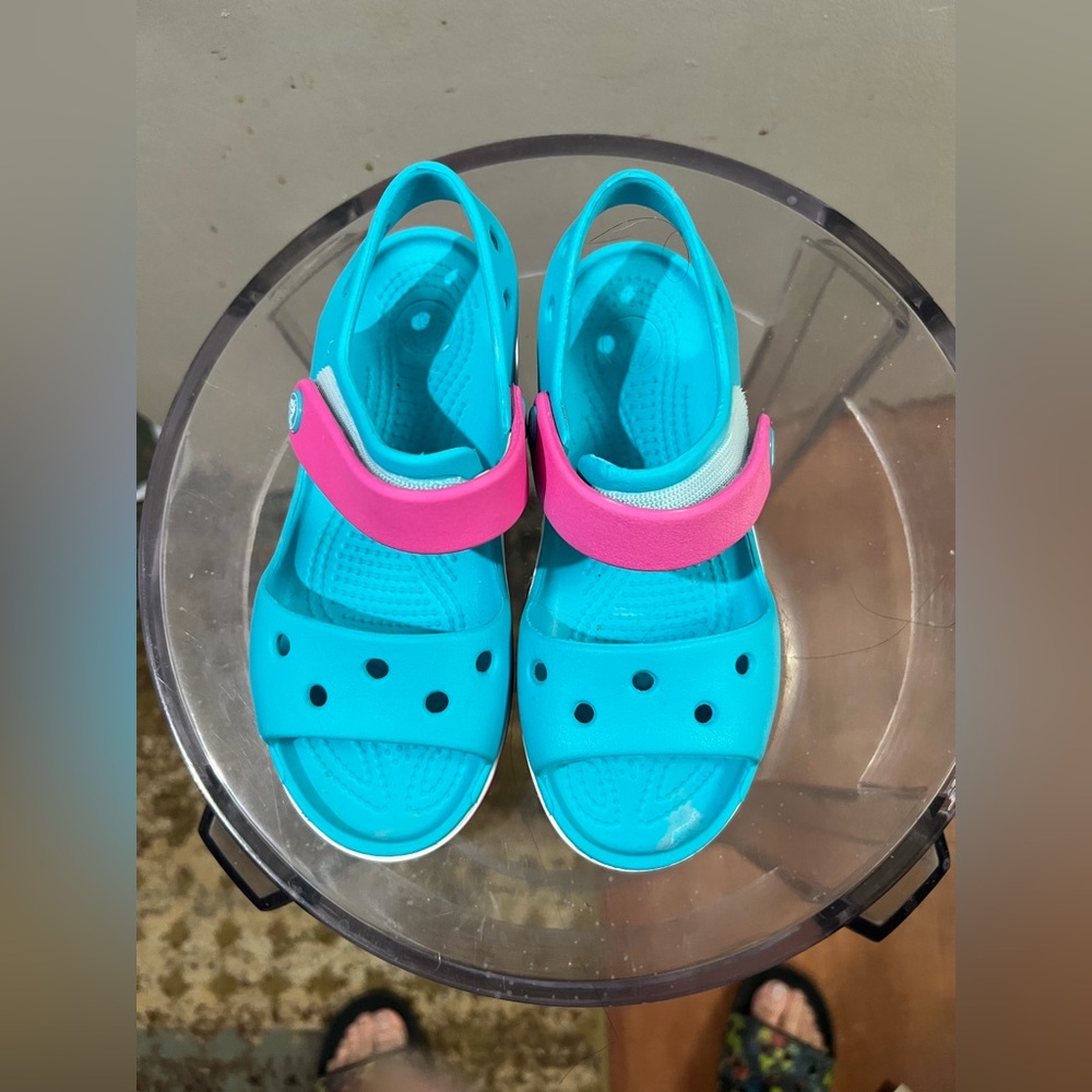 Girl’s light blue and pink crocs sandals